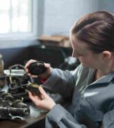 female-mechanic-holding-spare-parts-car_11zon